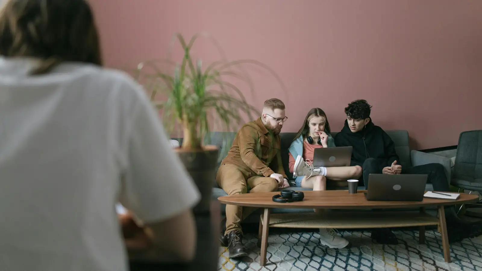 Founders reviewing mobile app success metrics on laptop